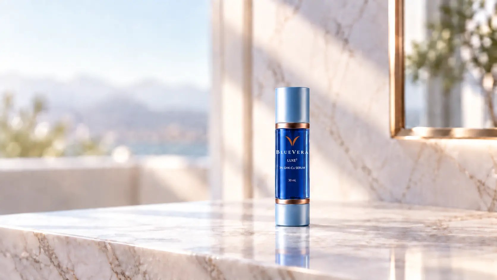 BlueVera LUXE³ dark cobalt 3% GHK-Cu serum in an airless bottle with the exact official wordmark on a marble bathroom benchtop